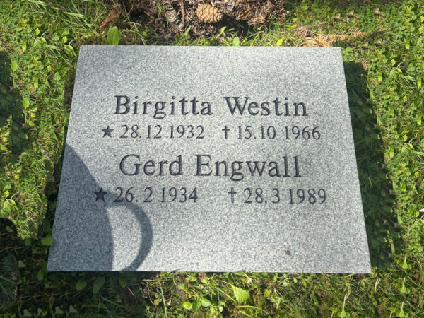 EN201 in grey Kuru granite, recessed engraving painted black.