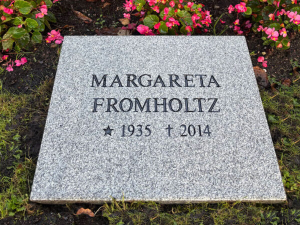EN201 in grey Kuru granite, recessed engraving painted black.